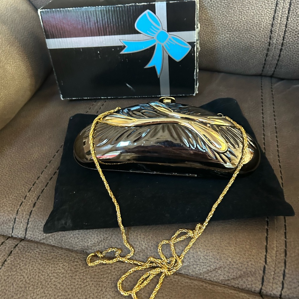 Vintage Sasha silver and gold clutch with shoulder chain.